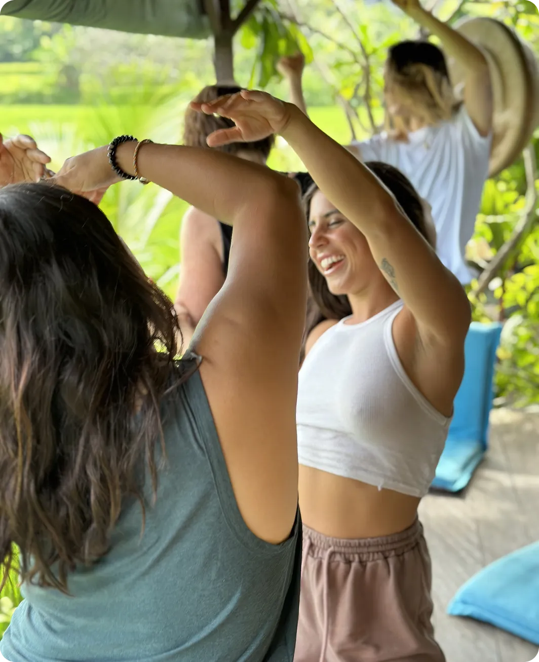 Woman with arms up emotions flowing through breathwork